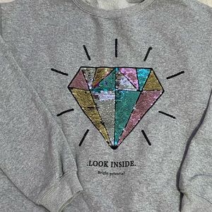 Gray girls floppy sequins crewneck from ZARA with small black lettering on front